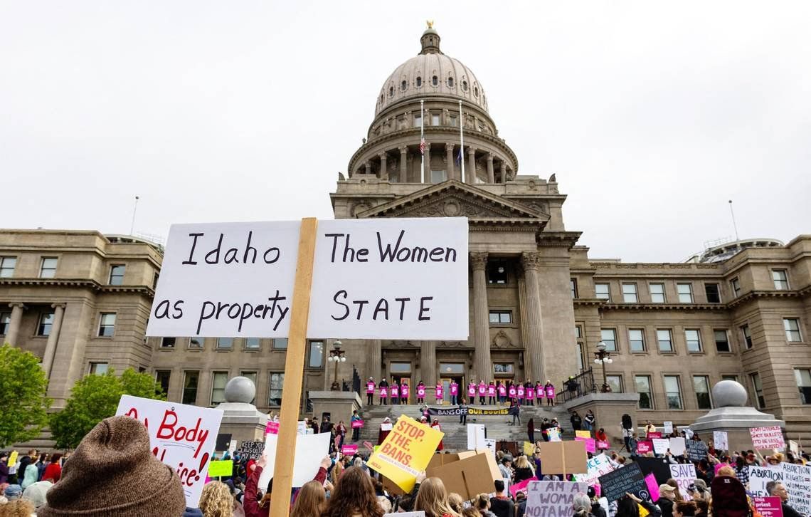 An attendee at an abortion rights rally holds a sign outside the Idaho Capitol on May 14. The U.S. Supreme CourtÂ’s reversal of Roe v. Wade and Planned Parenthood v. Casey, two landmark abortion cases, triggers a law in Idaho that bans most abortions.