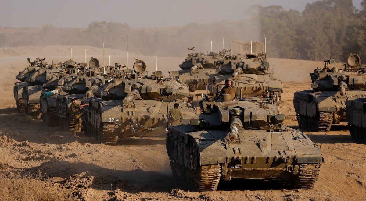 An Israeli soldier stands in a tank, amid the ongoing conflict between Israel and Hamas, near the Israel-Gaza border, in Israel, June 4, 2024.