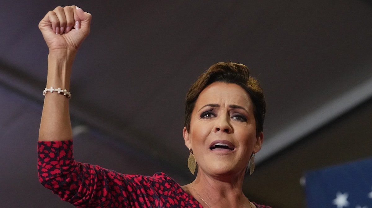 Arizona Republican Senate nominee Kari Lake gestures to the crowd gathered for vice presidential nominee JD Vance at Arizona Christian University on July 31, 2024.