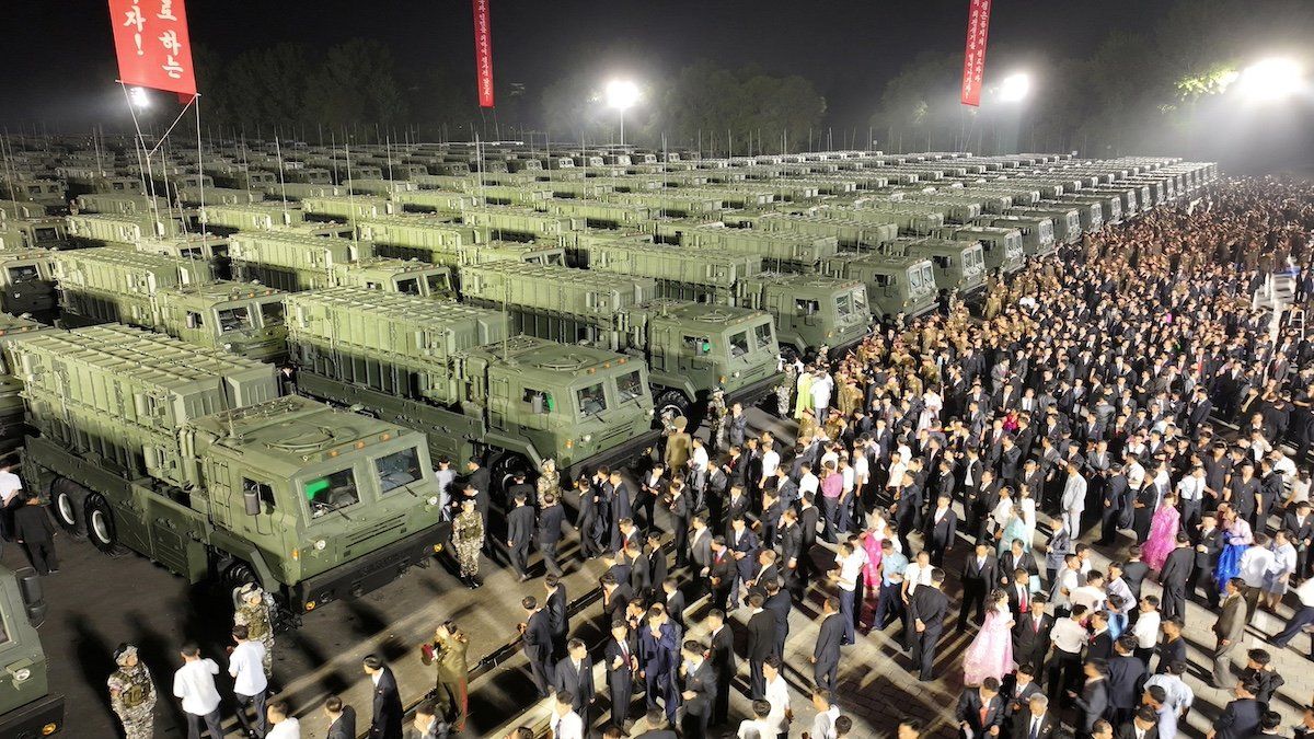 ​Attendees gather near tactical ballistic missile launchers during a ceremonial event to mark the delivery of new tactical ballistic missiles to North Korean troops at an undisclosed location in North Korea, August 4, 2024 in this photo released by North Korea's official Korean Central News Agency. 