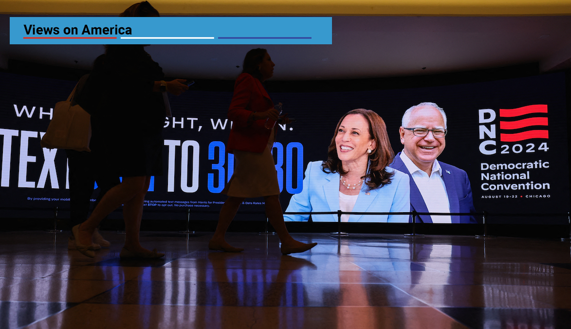 ​Attendees walk past a sign at the United Center ahead of the Democratic National Convention in Chicago, Illinois, on Aug. 19, 2024. 