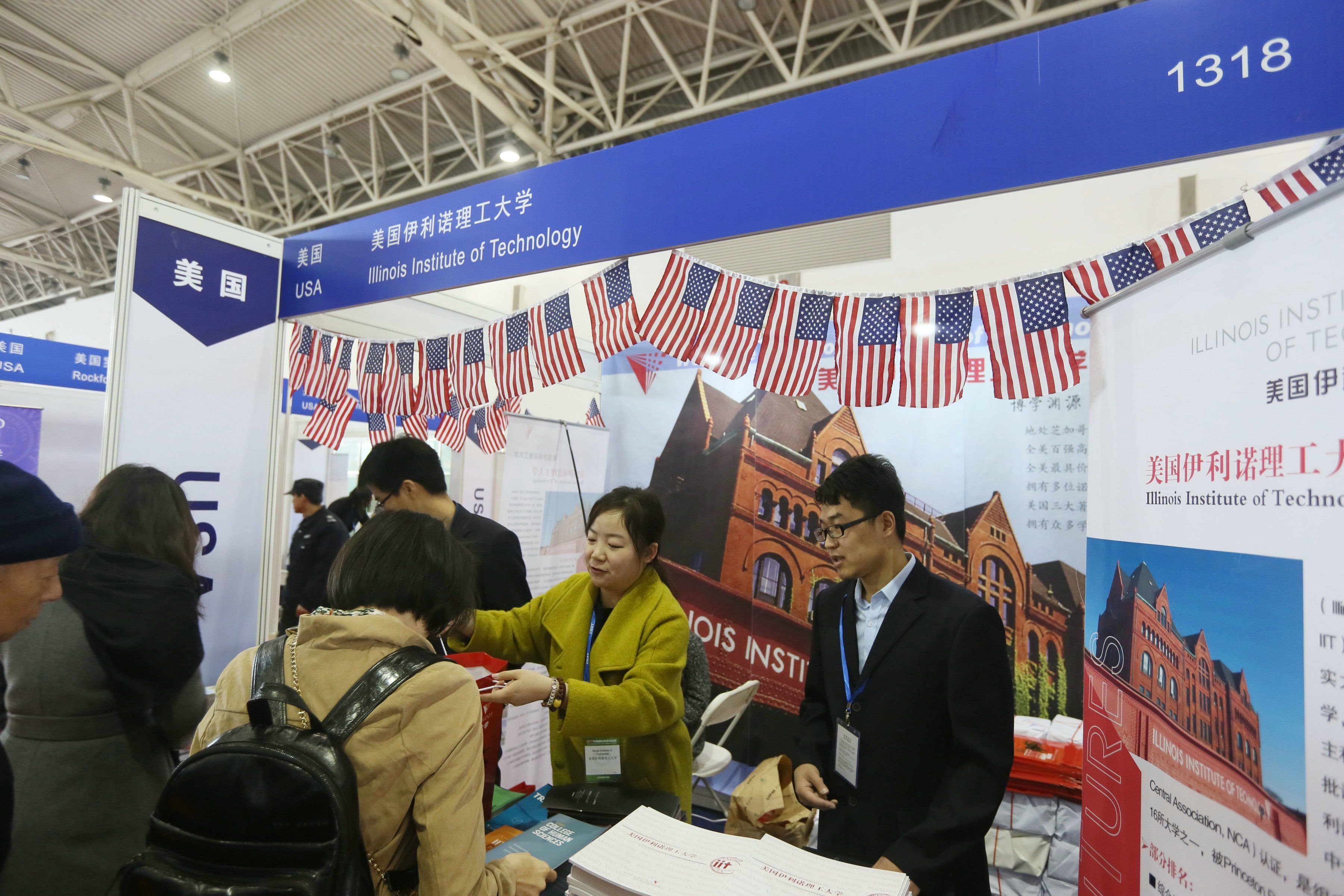 -Chinese visitors talk with education consultants at the booth of the United States during an expo in Beijing, China, 25 March 2017. 