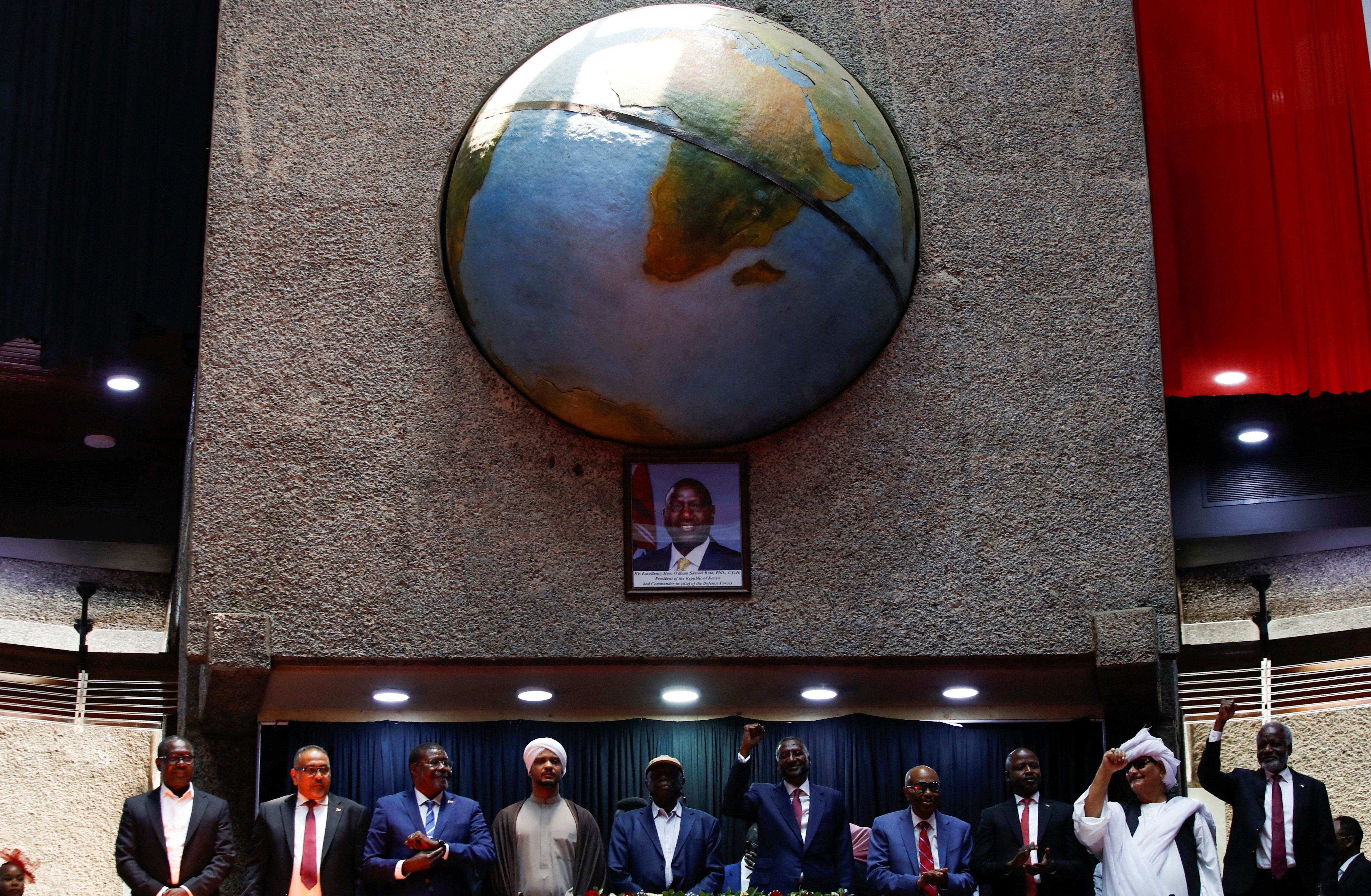 Delegates affiliated to Sudan's Rapid Support Forces (RSF) react during a meeting for the planned signing, later postponed, of a political charter that would provide for a "Government of Peace and Unity" to govern the territories the force controls in Nairobi, Kenya, February 18, 2025. 