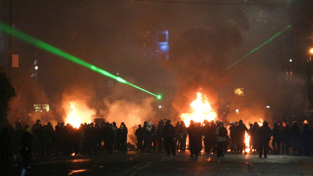 ​Demonstrators stand next to a fire during a protest against the new government's decision to suspend the European Union accession talks and refuse budgetary grants until 2028, in Tbilisi, Georgia December 2, 2024. 