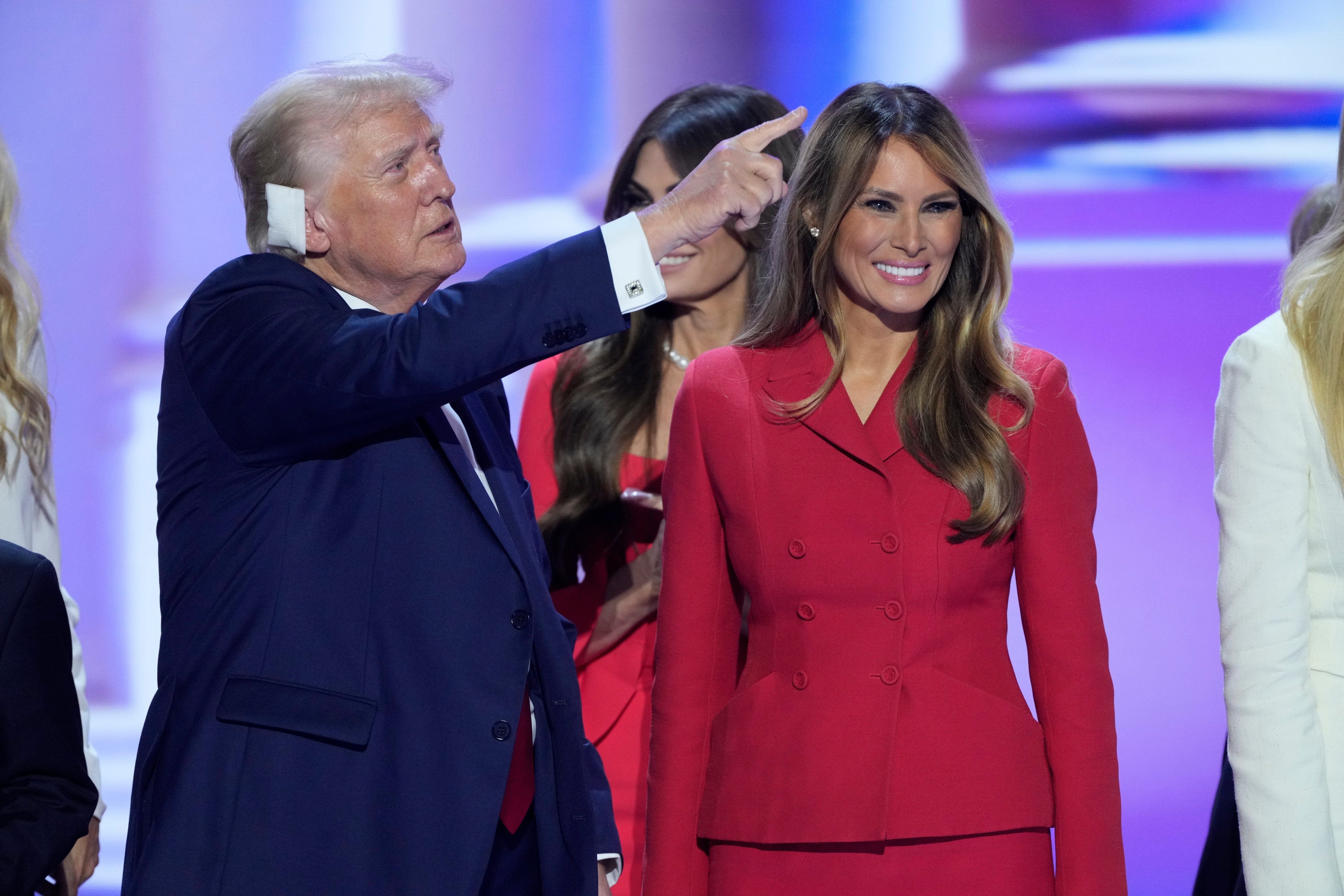 ​Donald Trump and Melania Trump stand on stage at the conclusion of the final day of the Republican National Convention at the Fiserv Forum on July 18, 2024 in Milwaukee, WI.