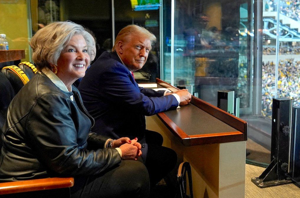 Donald Trump is seen here at a Jets football game next to his campaign manager Susie Wiles, on Oct. 20, 2024. The president-elect has just named Wiles his White House chief of staff.