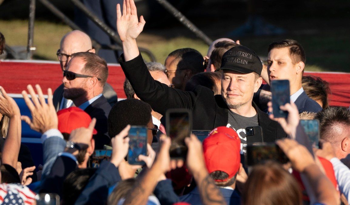 ​Elon Musk waves to the crowd before former President Donald Trump speaks at a campaign rally in Butler, Pa., on Oct. 5, 2024.