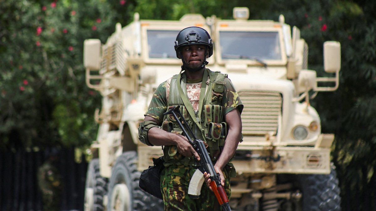 ​FILE PHOTO: A Kenyan police officer walks in front of an armoured personnel carrier during a joint operation with Haitian police, in Port-au-Prince, Haiti July 29, 2024. 