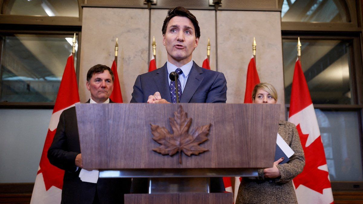 ​FILE PHOTO: Canada's Prime Minister Justin Trudeau, with Minister of Foreign Affairs Melanie Joly, and Minister of Public Safety, Democratic Institutions and Intergovernmental Affairs Dominic LeBlanc, takes part in a press conference about the Royal Canadian Mounted Police's investigation into "violent criminal activity in Canada with connections to India", on Parliament Hill in Ottawa, Ontario, Canada October 14, 2024. 