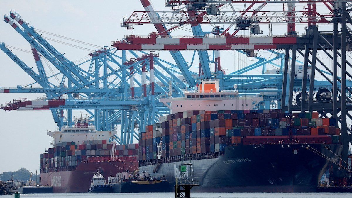 ​FILE PHOTO: Docked cargo ships are loaded with shipping containers at Port Elizabeth, New Jersey, U.S., July 12, 2023. 