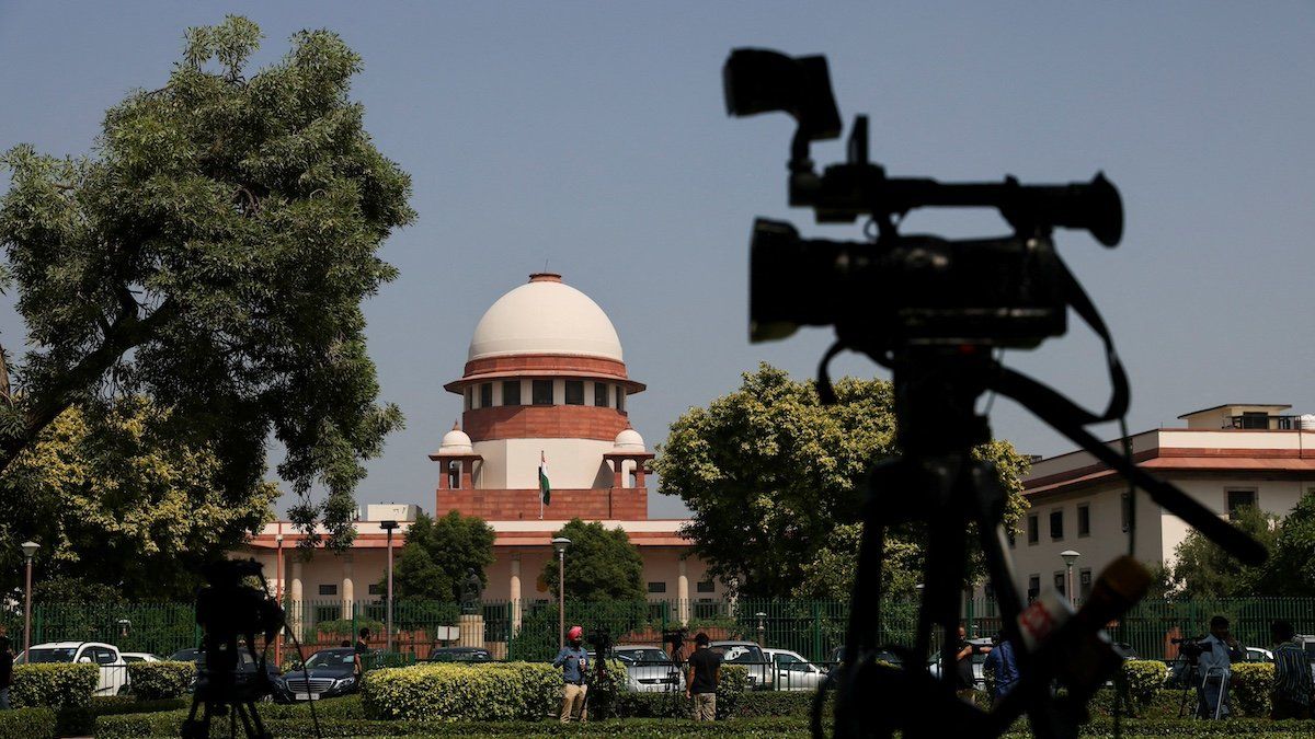 FILE PHOTO: Members of media speak in front of cameras outside the premises of the Supreme Court in New Delhi, India October 13, 2022. REUTERS/Anushree Fadnavis/File Photo