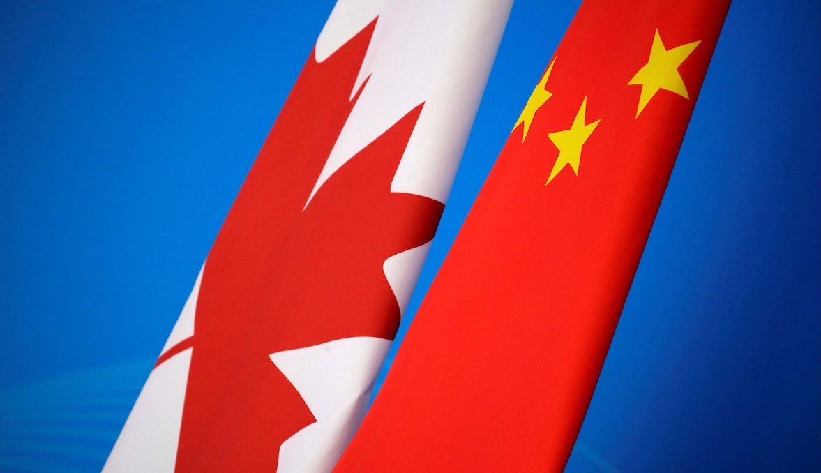 Flags of Canada and China. 