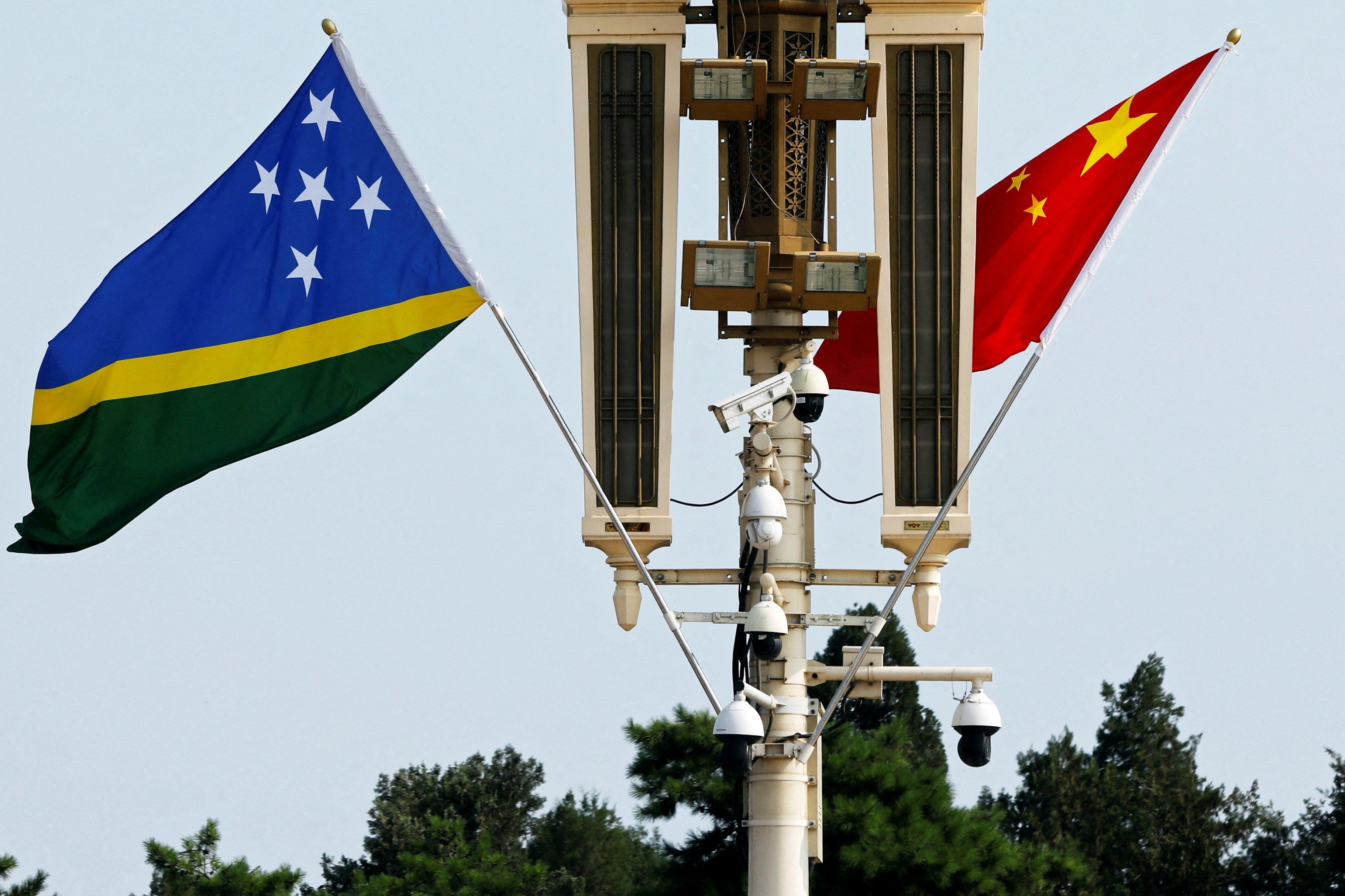 ​Flags of Solomon Islands and China flutter near the Tiananmen Gate in Beijing, China July 11, 2023. 