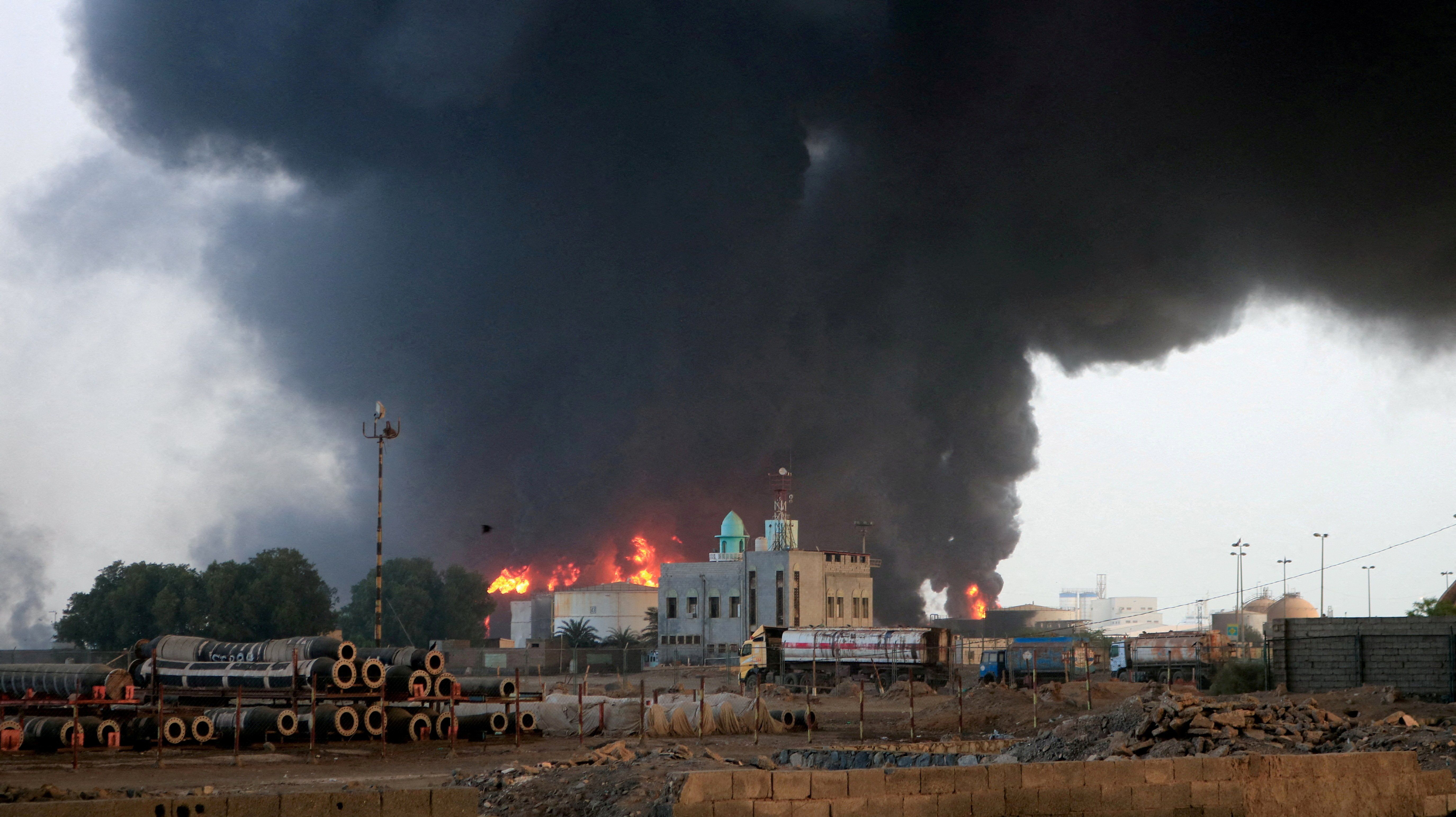 Flames and smoke rise from the site of Israeli air strikes at the port of Hodeidah, Yemen July 21, 2024. 