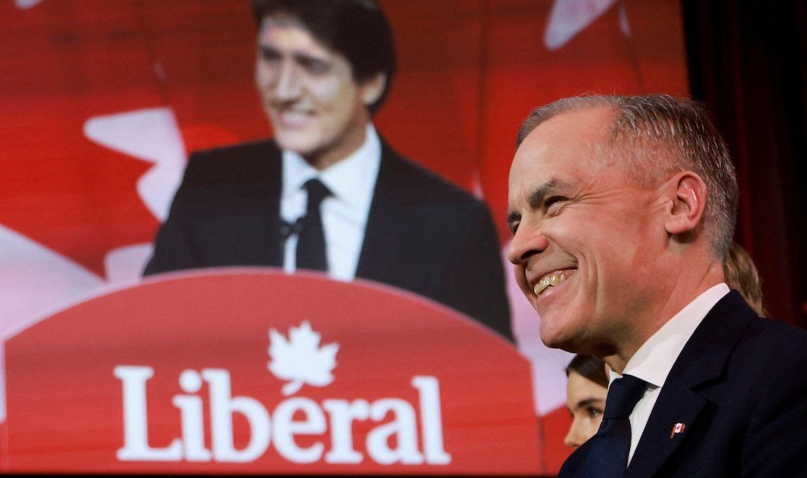 Former Bank of Canada and Bank of England Governor Mark Carney listens to outgoing Prime Minister Justin Trudeau's speech just before being elected to succeed Trudeau as Liberal Party leader on Sunday, March 9, in Ottawa, Canada.