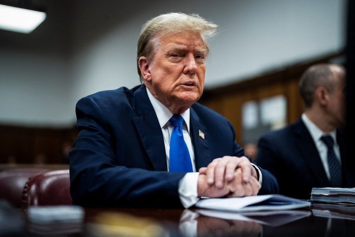 ​Former President Donald Trump arrives at Manhattan criminal court with his legal team as jury selection continues in New York City on Thursday, April 18, 2024. 