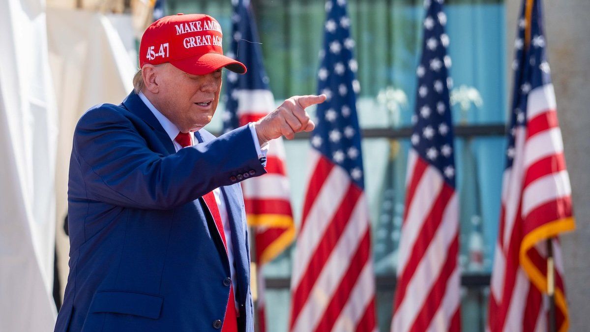 Former President Donald Trump signals to supporters at a rally on Tuesday June 18, 2024 at the Racine Festival Park in Racine, Wis.