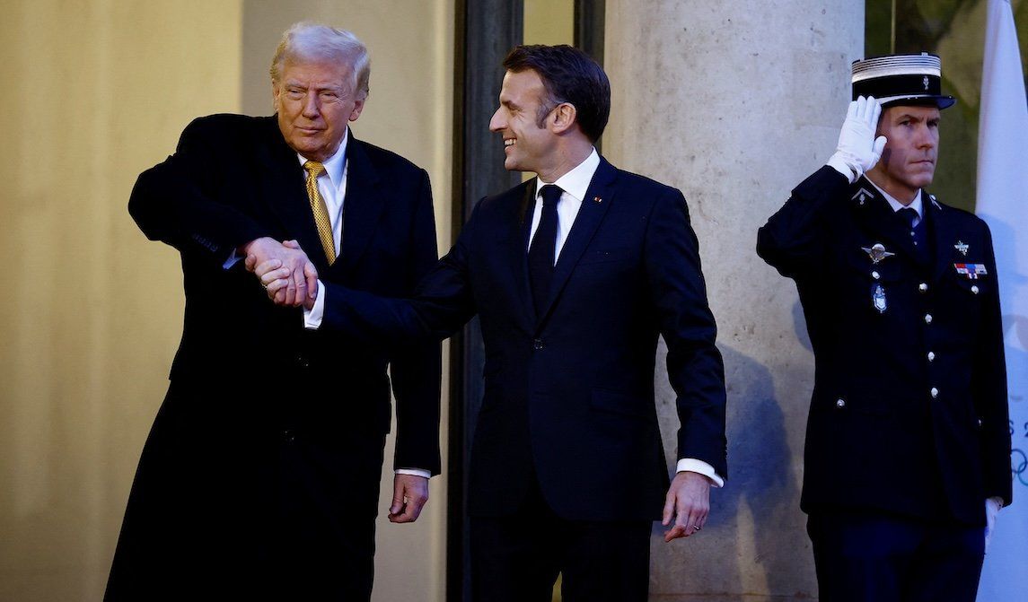 ​French President Emmanuel Macron shakes hands with US President-elect Donald Trump as he arrives for a meeting at the Elysee Palace in Paris as part of ceremonies to mark the reopening of the Notre-Dame de Paris Cathedral, in Paris, on Dec. 7, 2024.