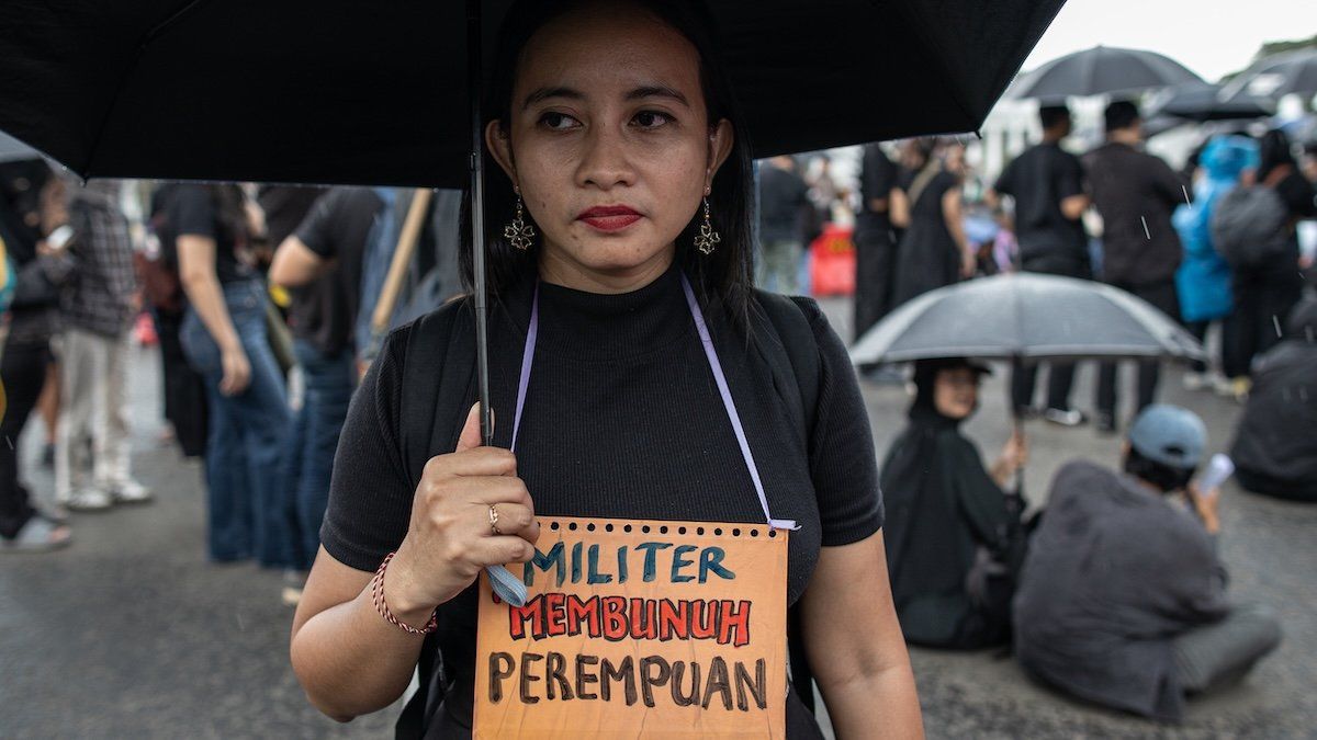 ​Human rights activists hold a placard reading 'Military is a Killer of Women' during Aksi Kamisan, or Thursday's Protest, in front of the Merdeka Palace in Jakarta, Indonesia, on March 20, 2025.