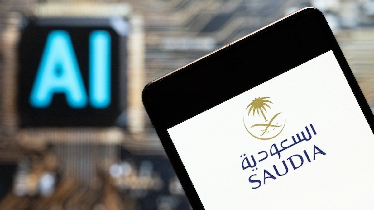 ​In this photo illustration, the Saudi Arabian Airlines (Saudia) logo seen displayed on a smartphone with an Artificial intelligence (AI) chip and symbol in the background. 