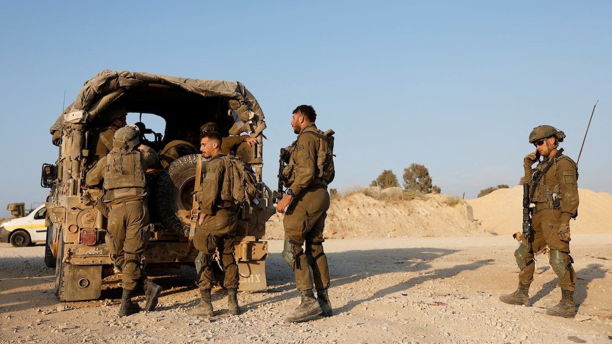 Israeli soldiers prepare to enter Gaza, amid the ongoing conflict between Israel and the Palestinian Islamist group Hamas, at Israel's border with Gaza in southern Israel, April 7, 2024.