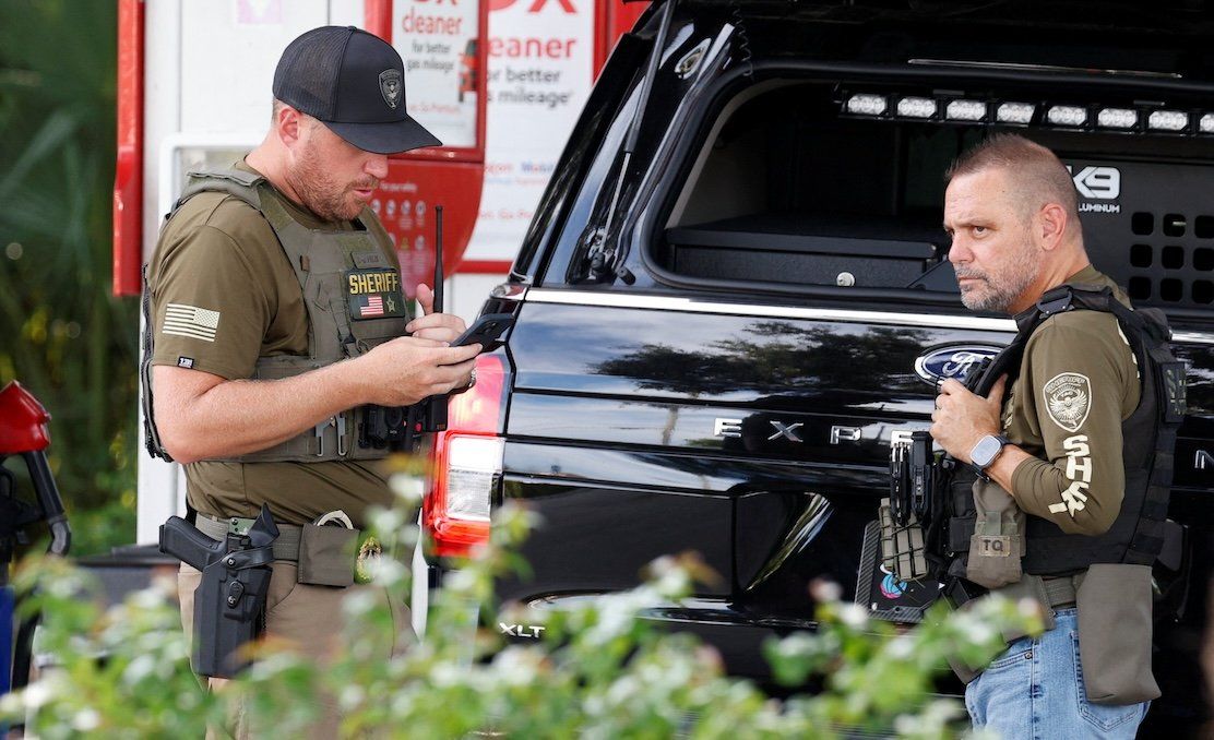 ​Law enforcement officers on the scene after reports of shots fired outside Republican presidential nominee and former President Donald Trump's Trump International Golf Course in West Palm Beach, Fla., on Sept. 15, 2024. 