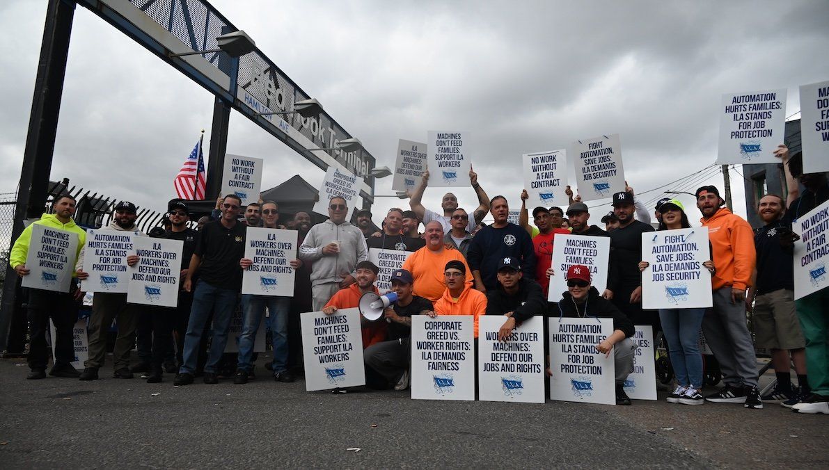 Longshoremen carry signs and demonstrate to make their voices heard outside Red Hook Terminal in Brooklyn, New York, on Oct. 2, 2024.