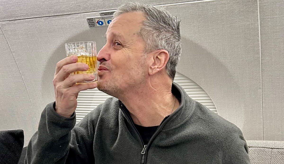 ​Marc Fogel, an American schoolteacher detained in Russia since August 2021, gestures on an airplane flying him back to the United States after U.S. special envoy Steve Witkoff secured his release February 11, 2025. 