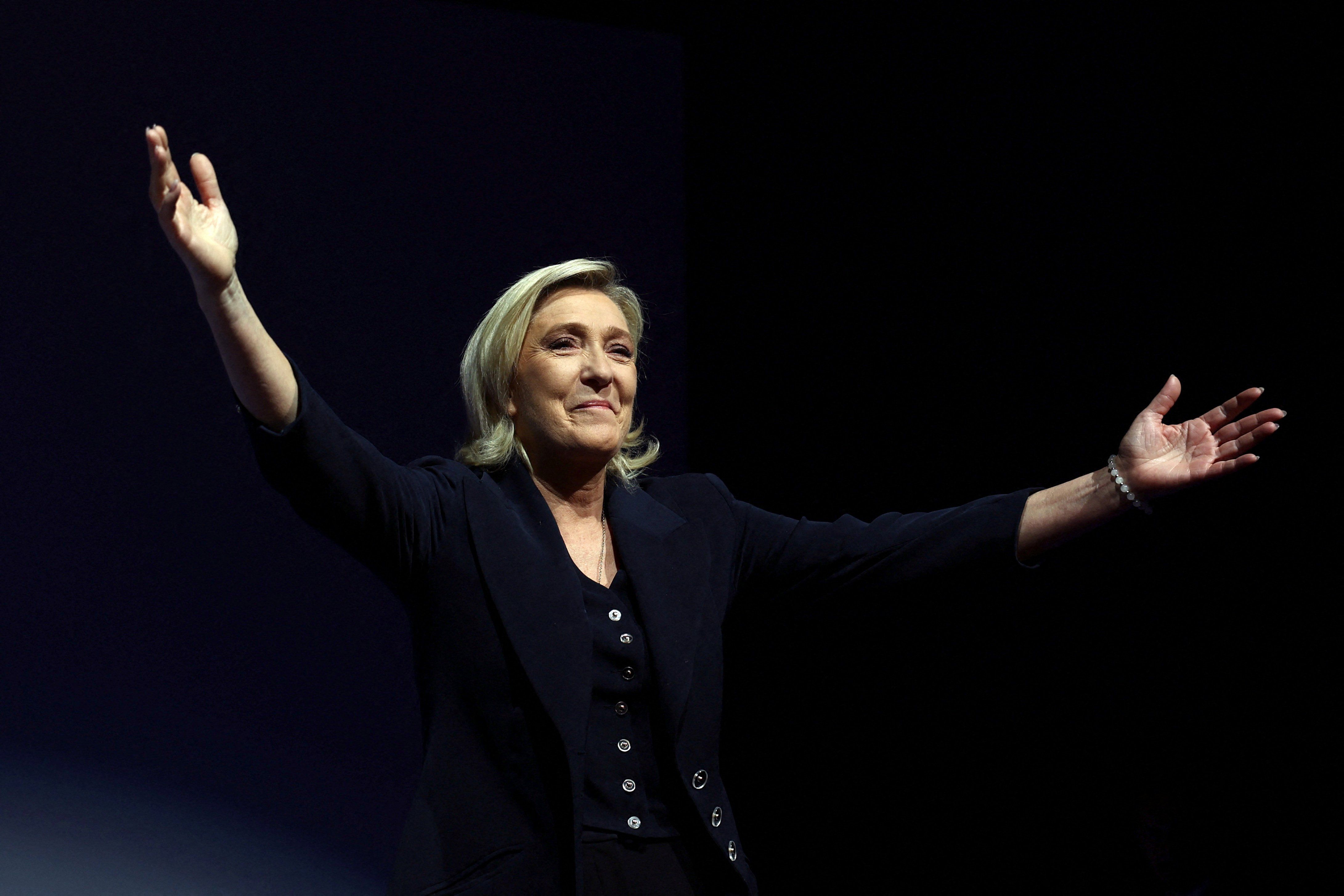 Marine Le Pen, French far-right leader and far-right Rassemblement National (National Rally - RN) party candidate, reacts on stage after partial results in the first round of the early French parliamentary elections in Henin-Beaumont, France, June 30, 2024. 