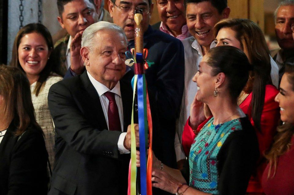 Mexico's President Andres Manuel Lopez Obrador hands over a ceremonial baton of command to Claudia Sheinbaum after she was elected by the ruling National Regeneration Movement (MORENA) as its candidate to succeed him in 2024 in the presidential election, in Mexico City, Mexico September 7, 2023. 