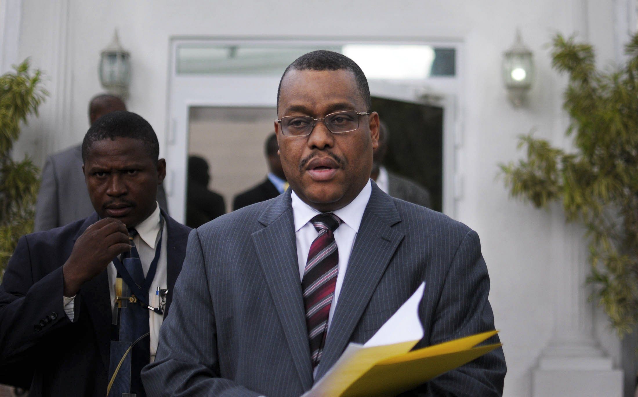 ​Newly appointed Haitian Prime Minister Garry Conille leaves a news conference in Port-au-Prince October 6, 2011. Haiti's Senate approved Conille as prime minister on Tuesday, endorsing President Michel Martelly's third nominee for the post in a move many hope will boost reconstruction efforts in the earthquake-ravaged nation. 