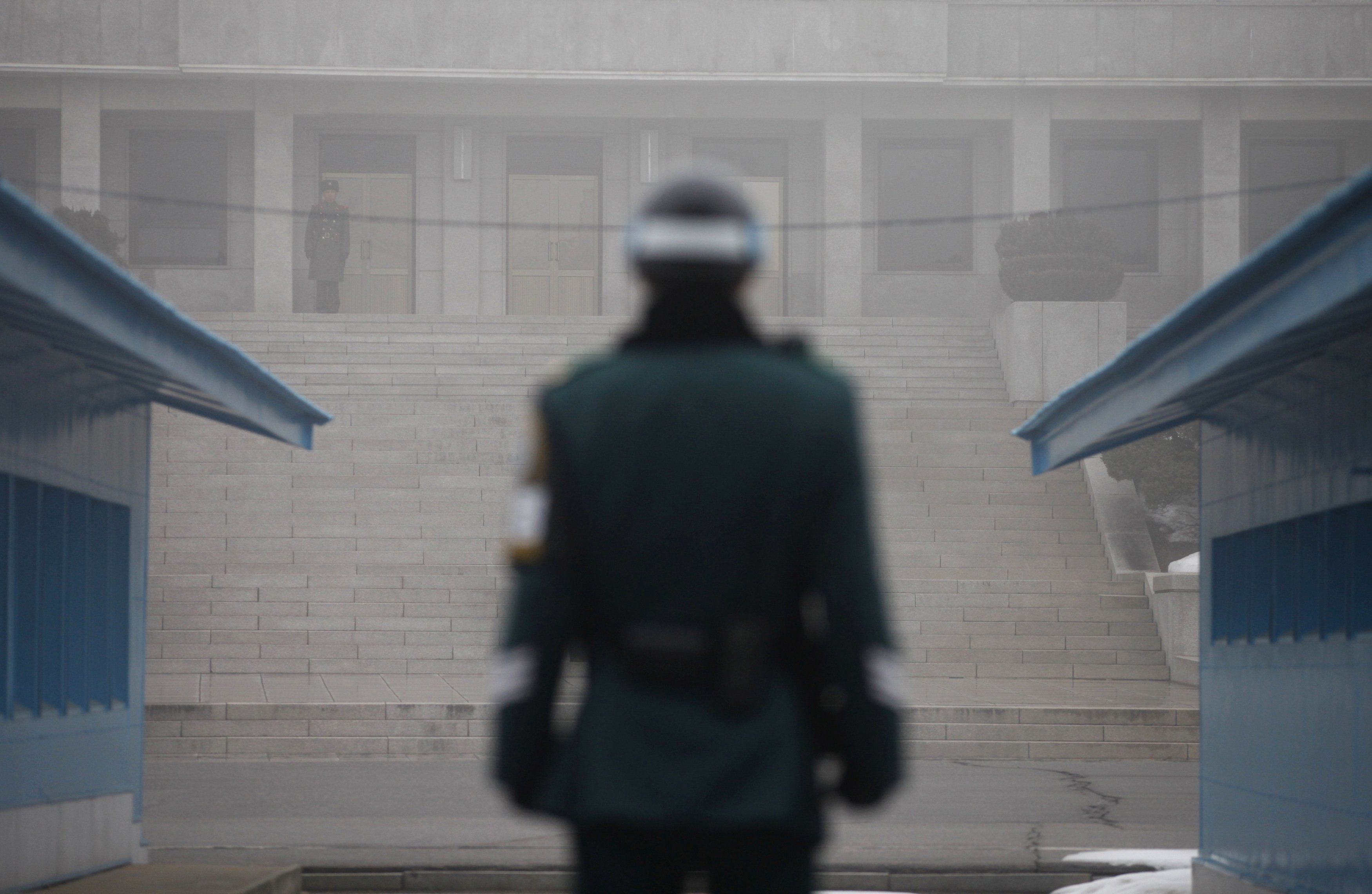 North Korean and South Korean troops stand guard in the "Truce Village" of Panmunjom in the DMZ.