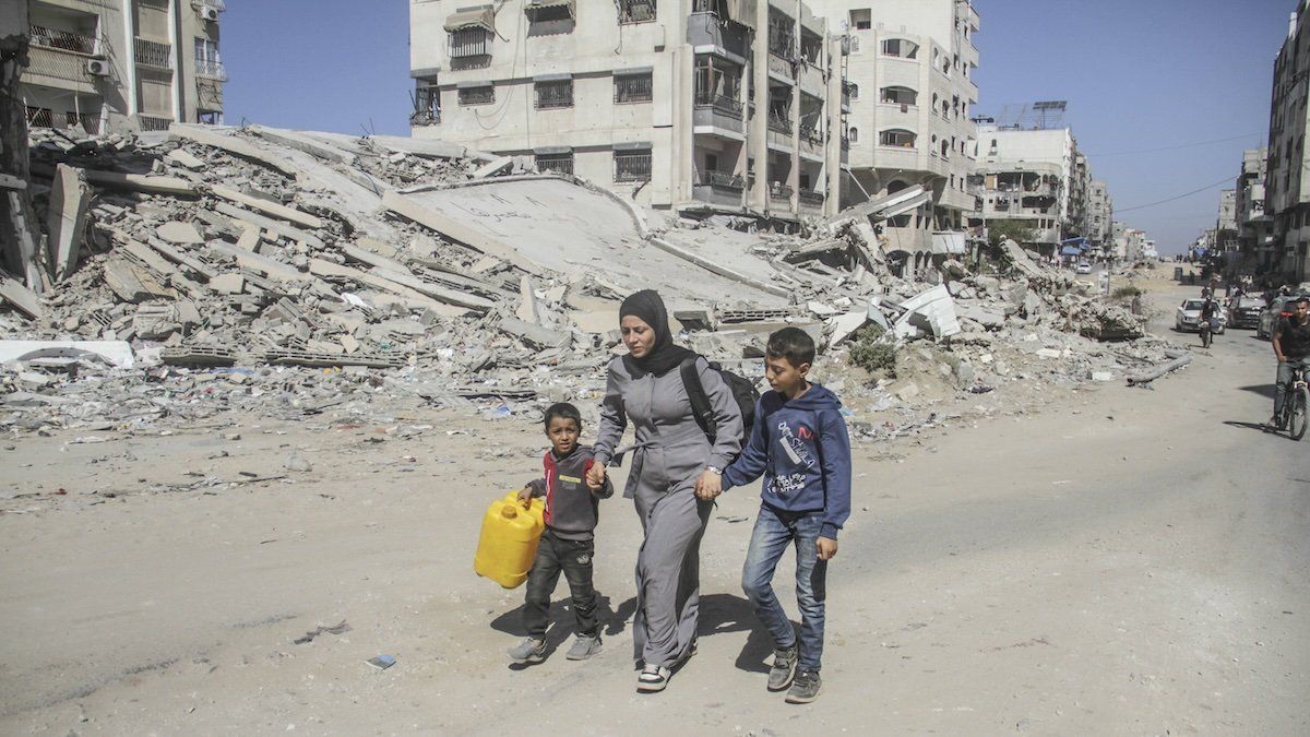 Palestinians walk during the evacuation of the Jabalia refugee camp and the Sheikh Radwan and Abu Iskandar neighborhoods in the northern Gaza Strip on October 12, 2024.