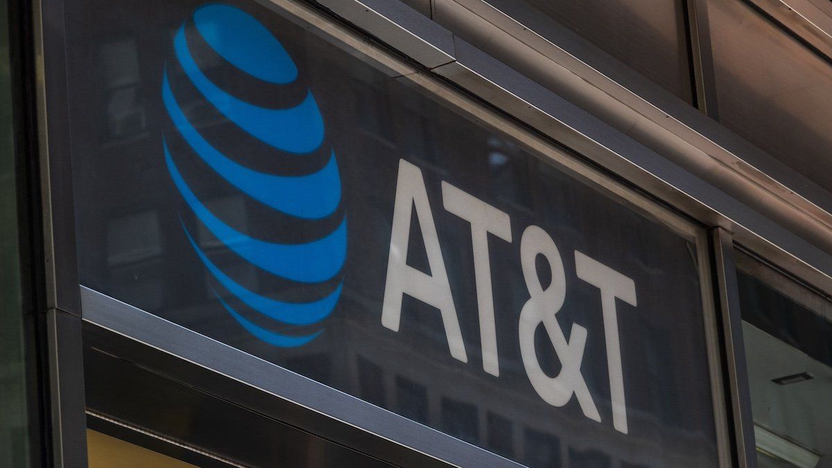 ​People are passing by an AT&T Inc store in Manhattan, New York City in the US with the company's logo and inscription visible. AT&T Inc. the American Telephone and Telegraph Company is an American multinational telecommunications holding company headquartered at Whitacre Tower in Downtown Dallas, USA. As of March 2024 there was a data breach with leaks of personal data of 73 million customers in the dark web according to the media. NYC, United States of America on May 2023 