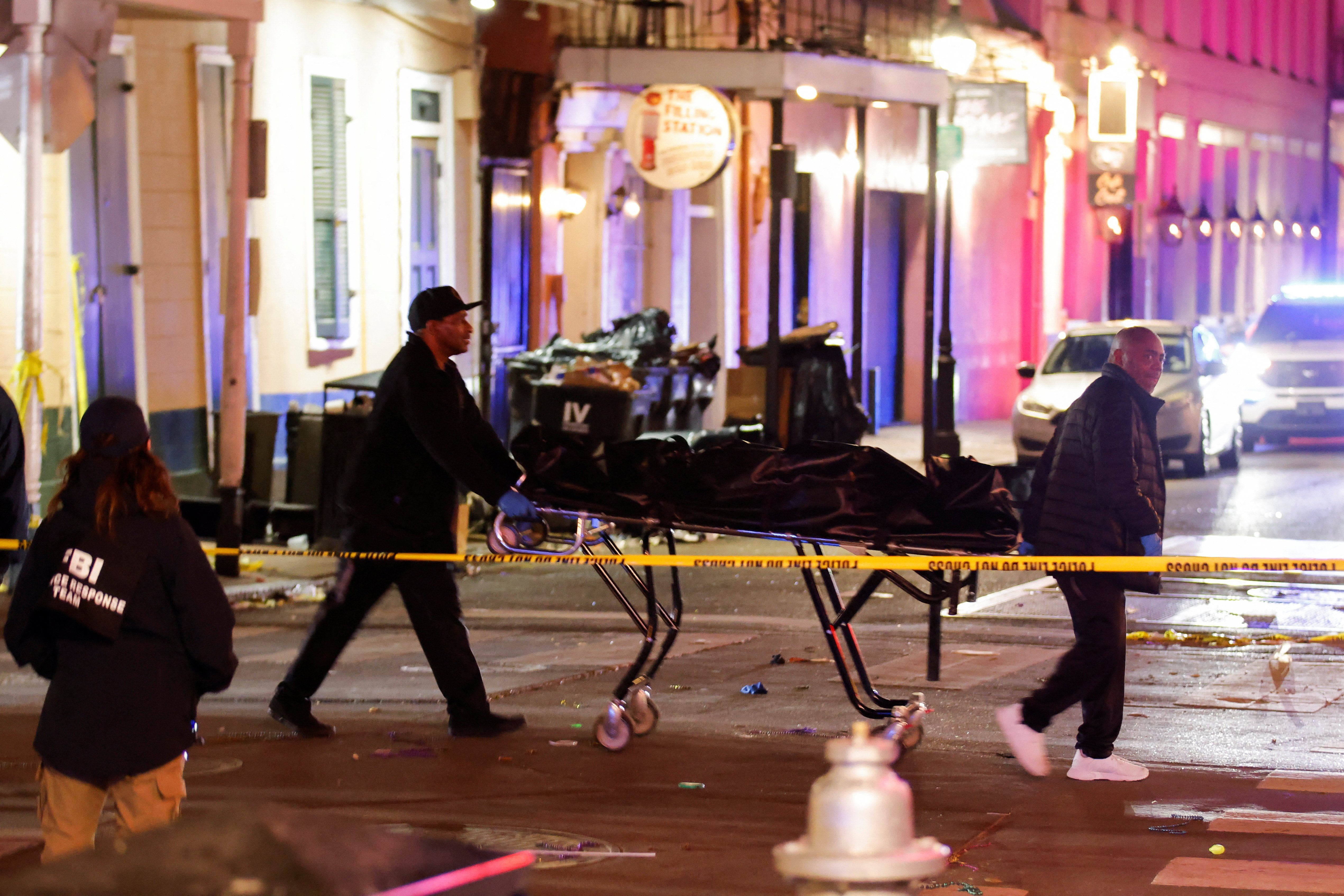 ​People carry a dead body in a body bag on a stretcher near the site where people were killed by a man driving a truck in an attack during New Year's celebrations, in New Orleans, Louisiana, U.S., January 2, 2025. 