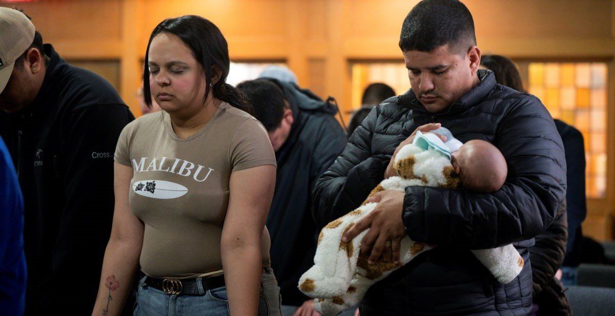 ​People gather during a service at Starting Point Community Church, which assists members of the newly arrived migrant community, amid concerns of intensified immigration enforcement. 