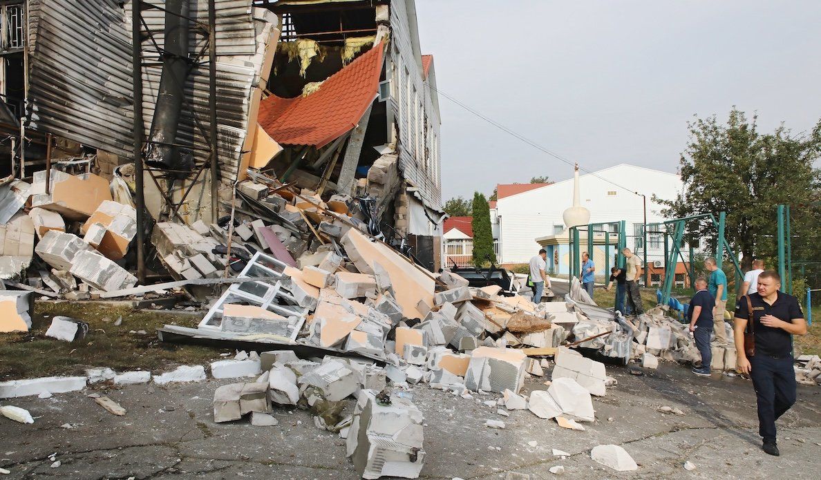 ​People inspect a damaged building after the Russian missile attack on the premises of the lyceum of the Interregional Academy of Personnel Management in Poltava, Ukraine.