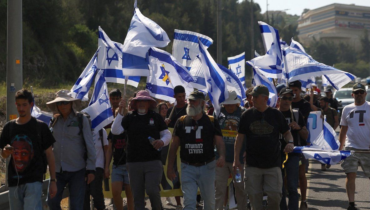 ​People march towards Jerusalem during a rally against the government and Israeli Prime Minister Benjamin Netanyahu to demand the release of all hostages from Gaza, on March 18, 2025. 