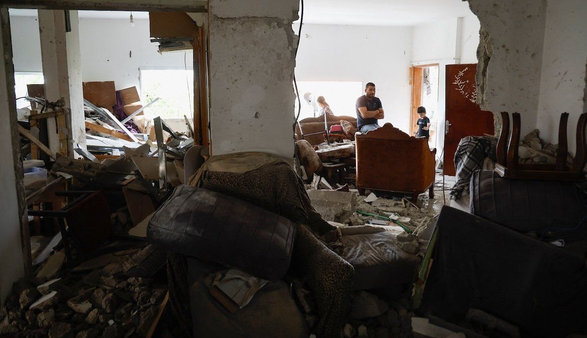 ​People react inside a damaged residence following an Israeli raid, in Jenin, in the Israeli-occupied West Bank, on Sept. 6, 2024. 