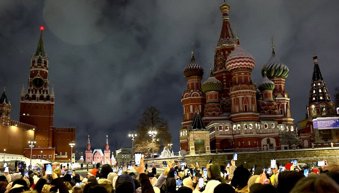 People take part in New Year celebrations near the Spasskaya Tower of the Kremlin and St. Basil’s Cathedral in central Moscow, Russia, on Jan. 1, 2025.