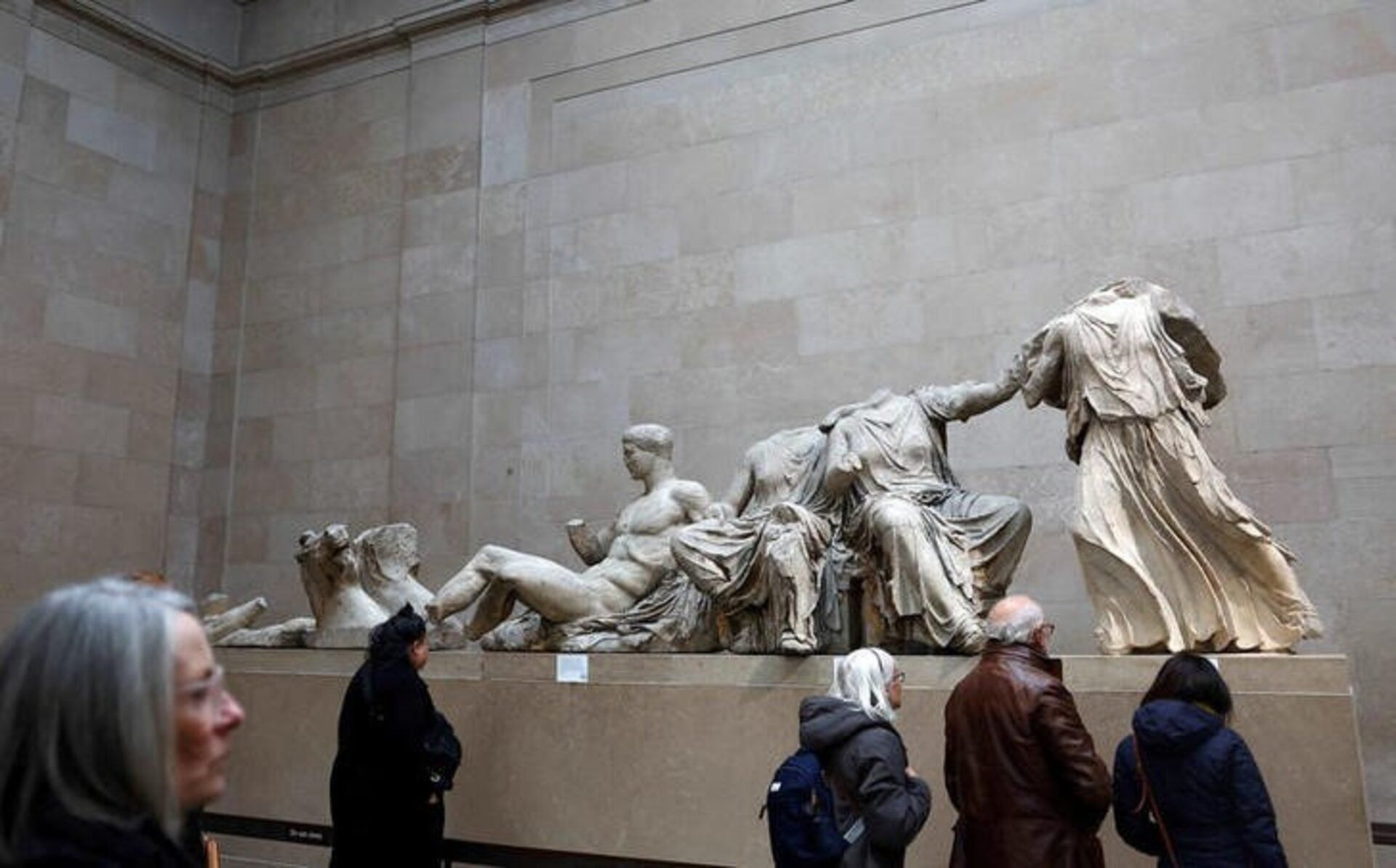 People view examples of the Parthenon sculptures, sometimes referred to in the UK as the Elgin Marbles, on display at the British Museum in London, Britain, November 29, 2023.