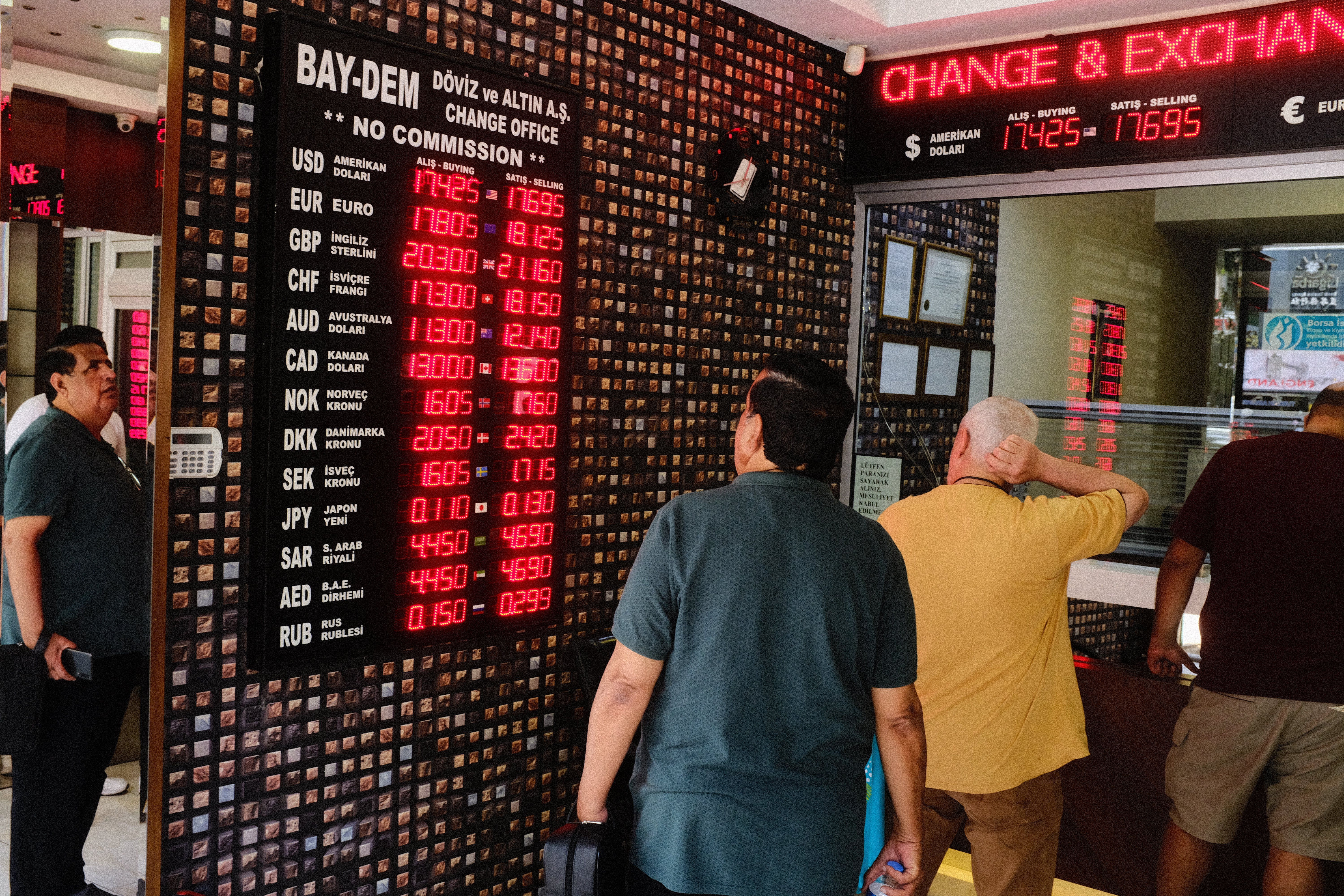 Persons transacting at the exchange office in Istanbul, Turkey