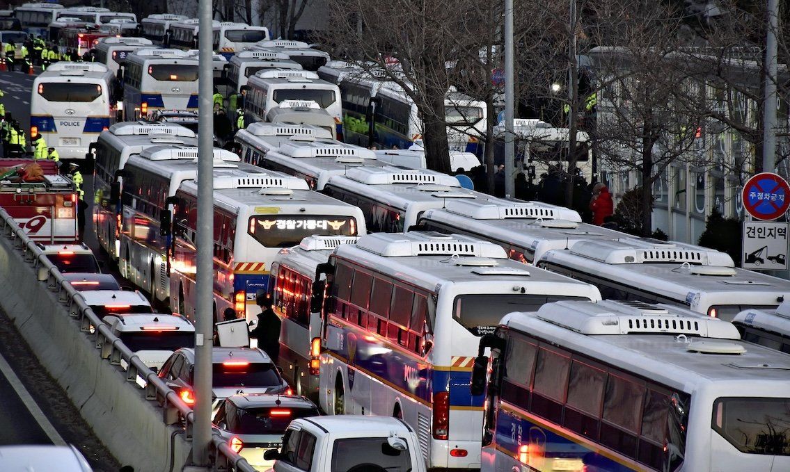 Police vans are lined up in front of South Korean President Yoon Suk Yeol's official residence in Seoul on Jan. 3, 2025.