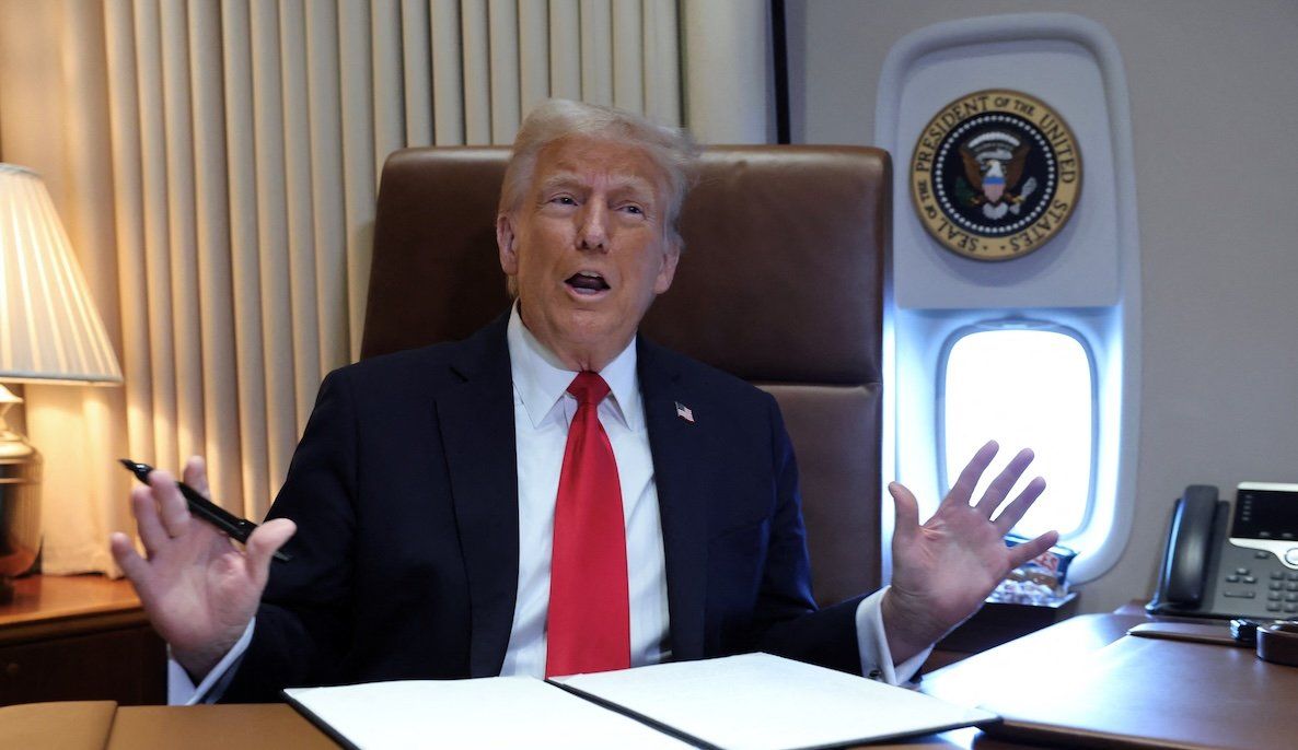 President Donald Trump speaks to reporters aboard Air Force One en route to New Orleans to attend the Super Bowl, on Feb. 9, 2025. 