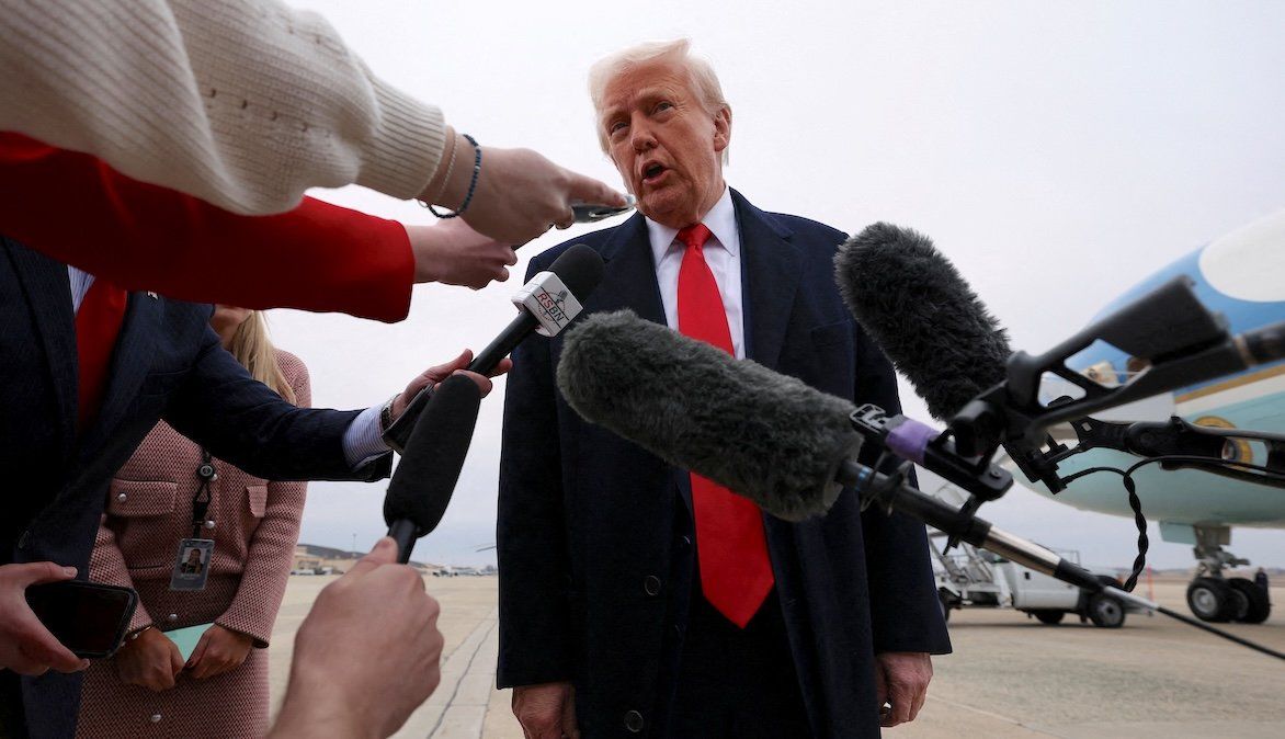 ​President Donald Trump speaks to reporters before boarding Air Force One as he departs from Joint Base Andrews in Maryland, on March 14, 2025. 