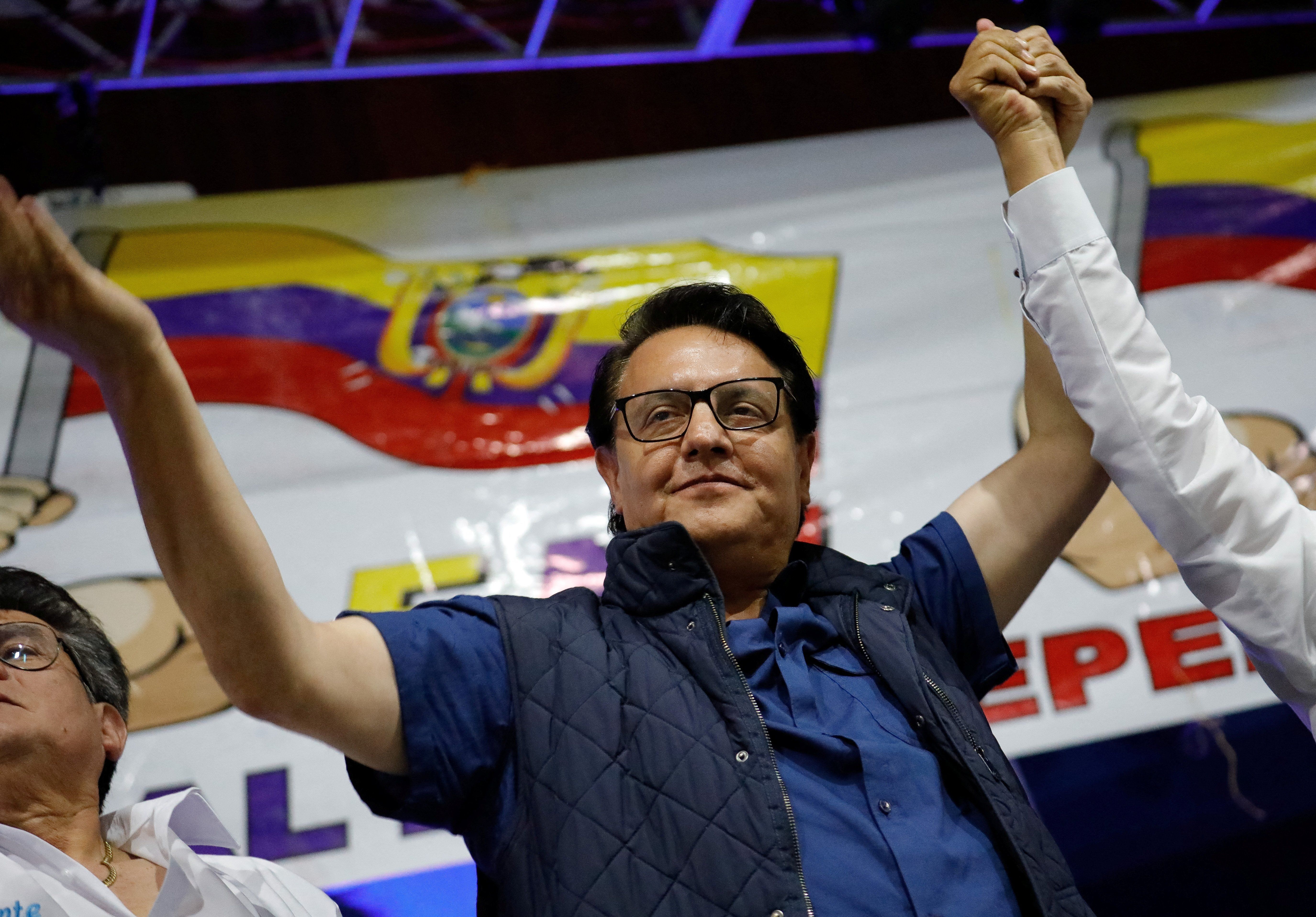 Presidential candidate Fernando Villavicencio waves an Ecuadorian flag as he attends a rally in Quito, Ecuador, on Aug. 9, 2023. 