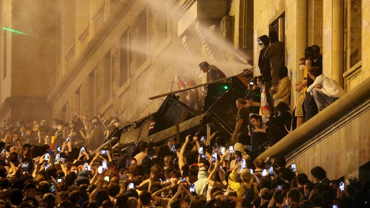 Protesters barricade the entrance of Parliament during a rally to protest against a bill on "foreign agents", in Tbilisi, Georgia, May 2, 2024.