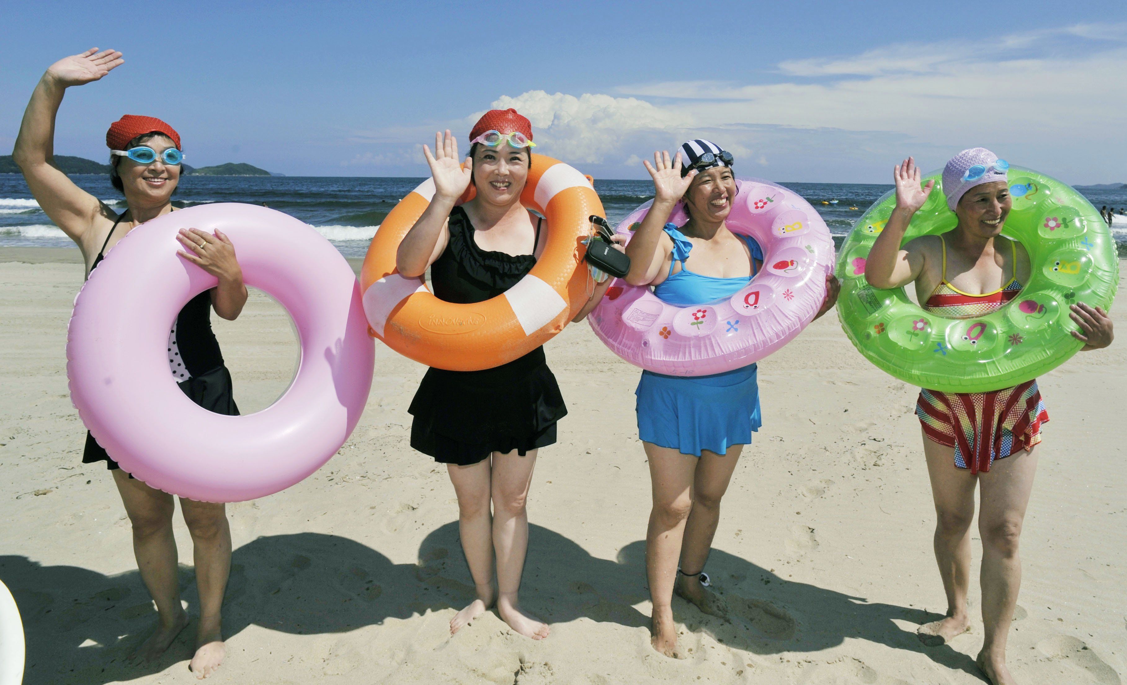 PYONGYANG, North Korea - A group of women visit a beach resort in Wonsan, North Korea, in September 2013. The women said they are coworkers at a clothes factory in the capital Pyongyang and their trip to Wonsan is a reward for an increase in output. 