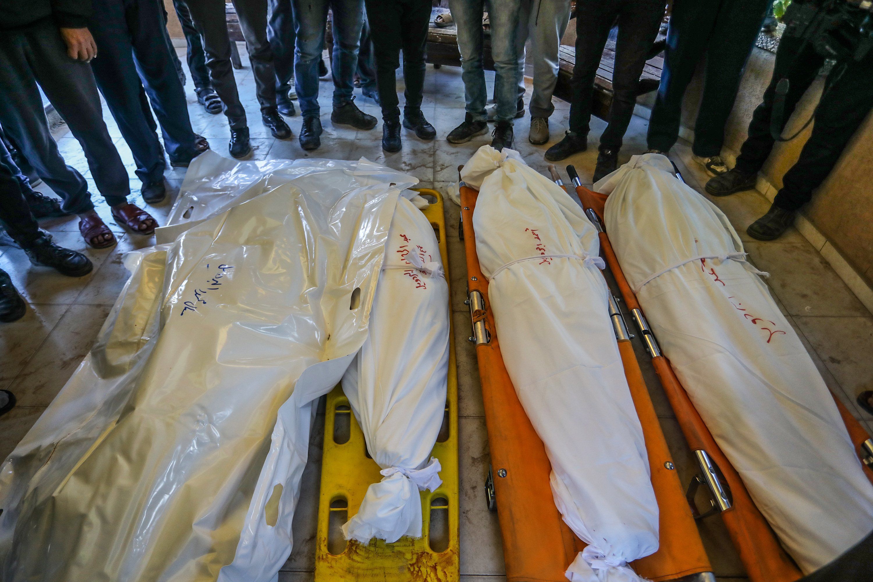 ​Relatives of Palestinians, who lost their lives following the Israeli attack on a makeshift displacement camp in Mawasi Khan Yunis, mourn as the bodies are brought to Nasser Hospital for burial process.