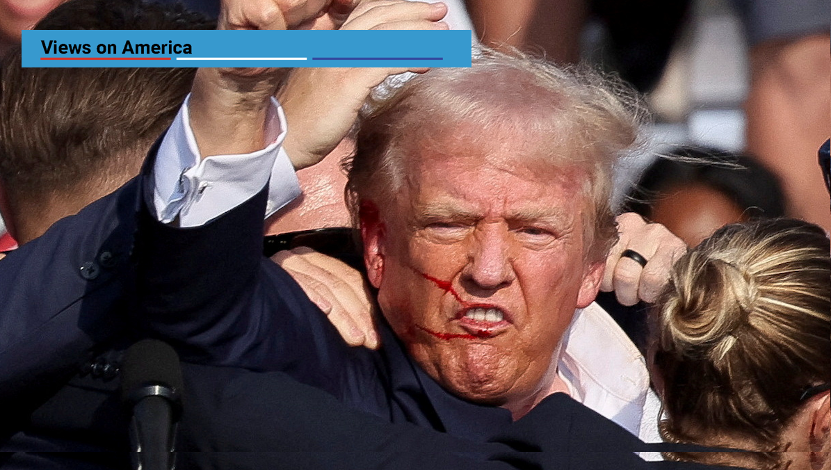 Republican presidential candidate and former US President Donald Trump is assisted by the Secret Service after gunfire rang out during a campaign rally at the Butler Farm Show in Butler, PA, on July 13, 2024. 